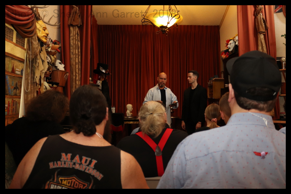 Tobias working with students in a performance magic class.